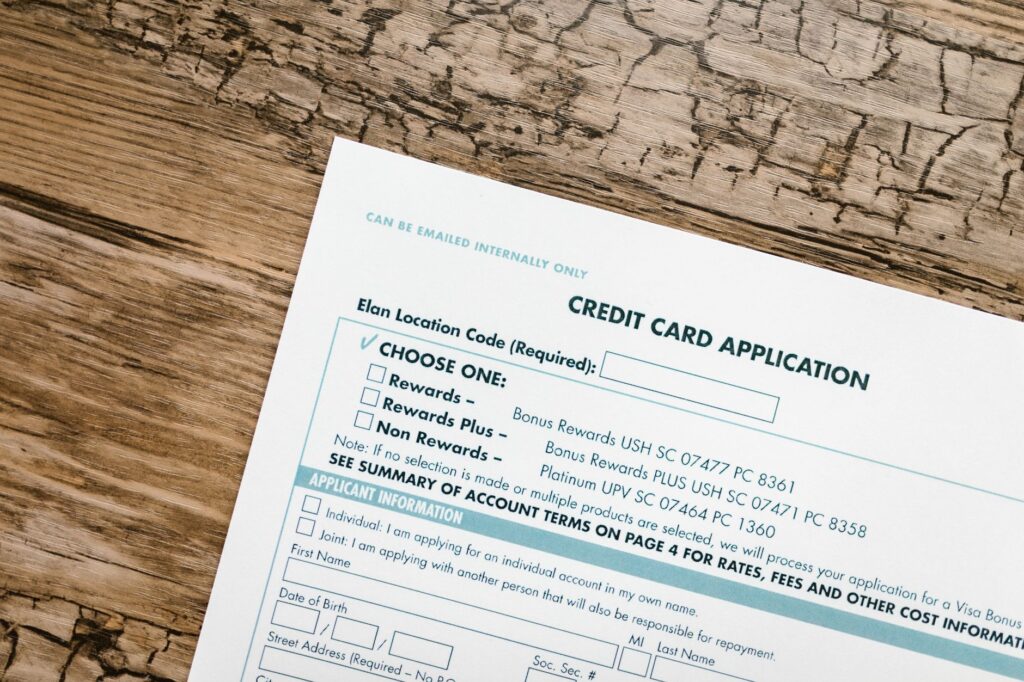Person organizing identity, immigration and Ontario residency documents for a health card application
